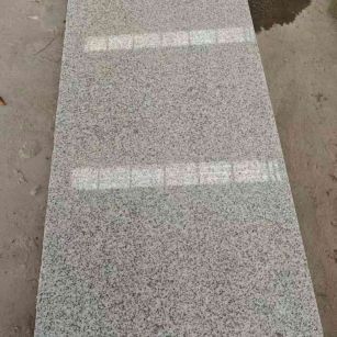 黑龙江芝麻白光面毛板